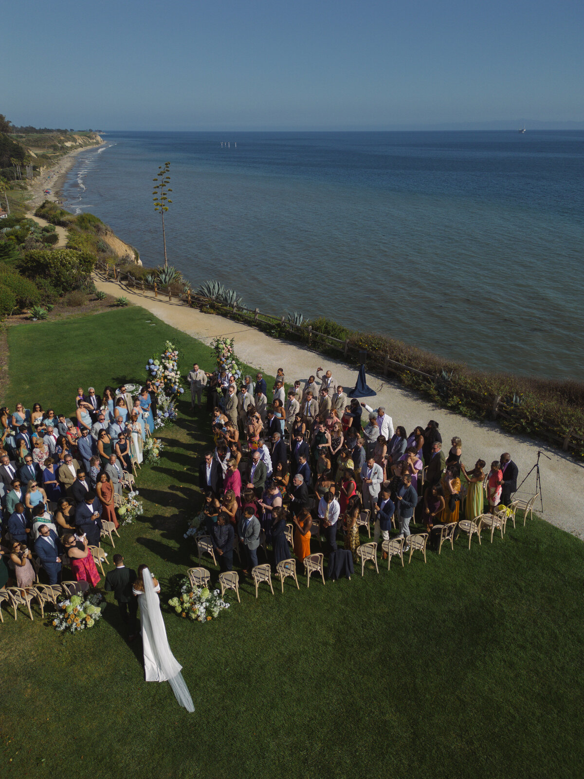 drone shot of coastal exclusive luxury wedding ceremony in santa barbara california