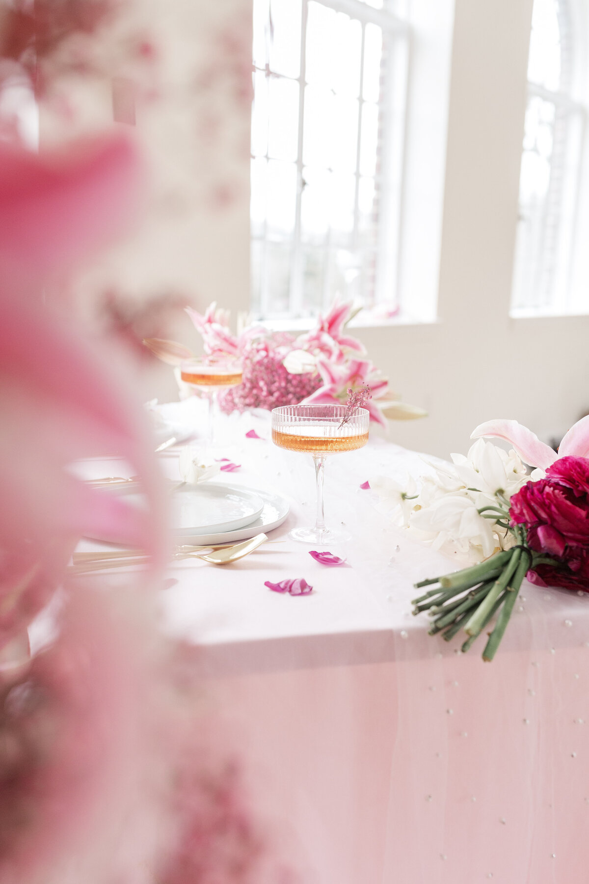 pink table with cocktails and florals
