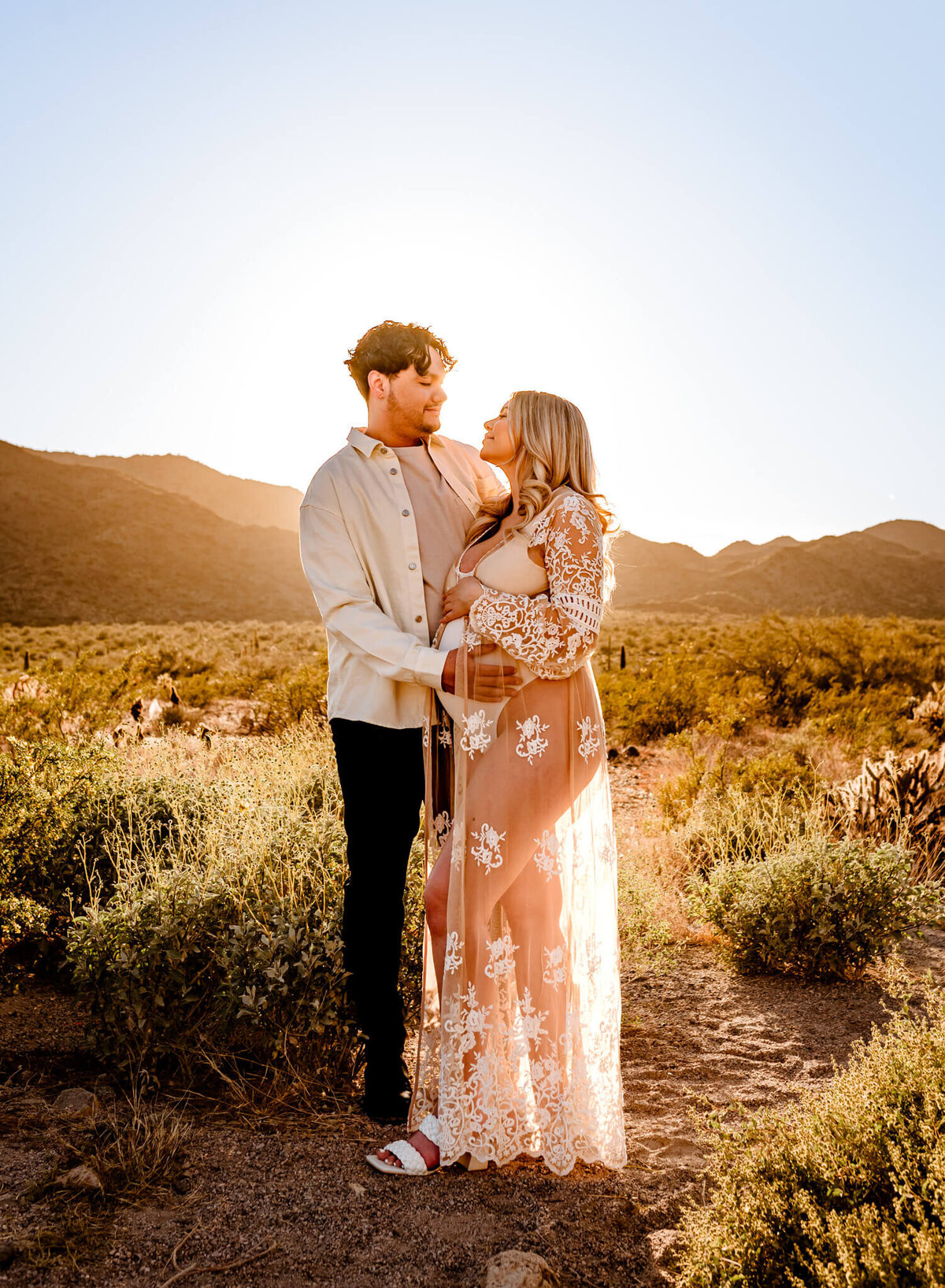 parents-to-be hugging each other during maternity photo session in Arizona