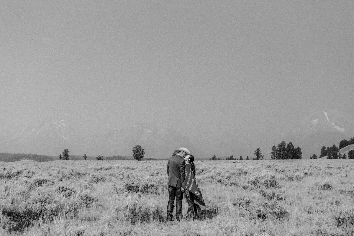 Wyoming engagement session featuring the Grand Tetons in the distance