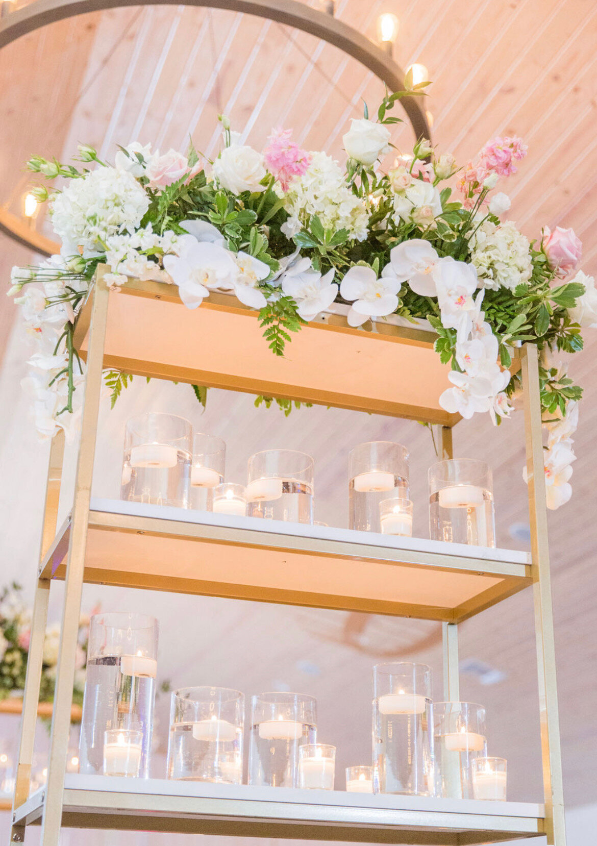 glass candles on a shelf at a wedding
