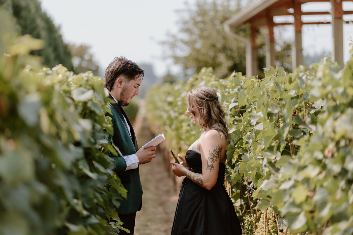 private vow exchange during a summer wedding at jacquot vineyards in brush prairie washington