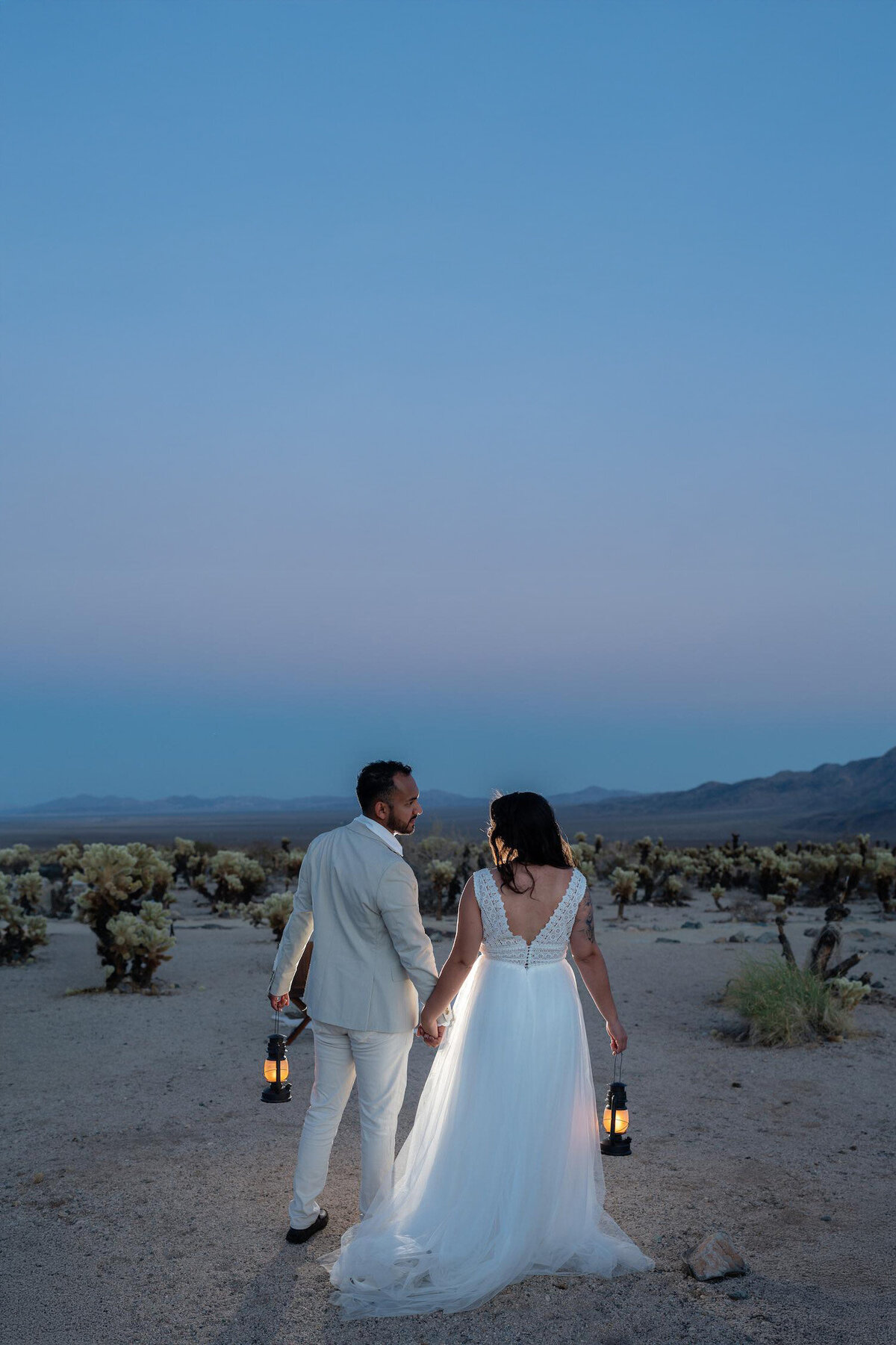 Joshua Tree Elopement Bride and Groom during a vibrant Blue Hour night with Lanterns