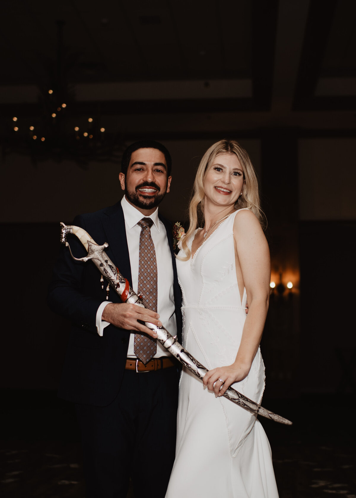 Photographers Jackson Hole capture couple holding sword
