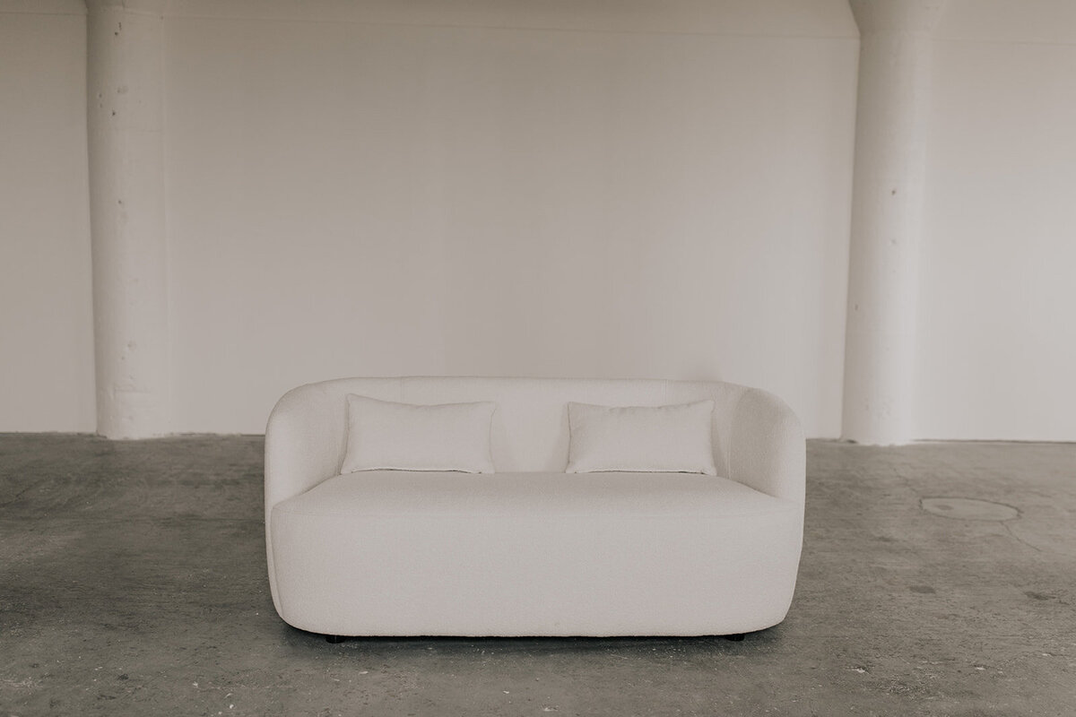 White boucle sofa at Kindred Studios