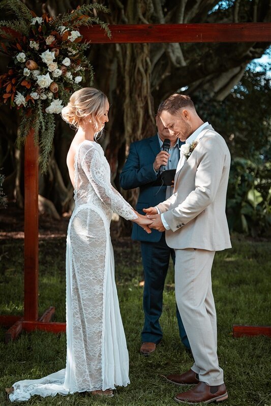 Experience the pure joy and love captured in every moment as Maddi & Jeremy intertwine their hands, creating a timeless symbol of unity. Immerse yourself in the heartfelt words of the celebrant, resonating with the essence of their commitment.