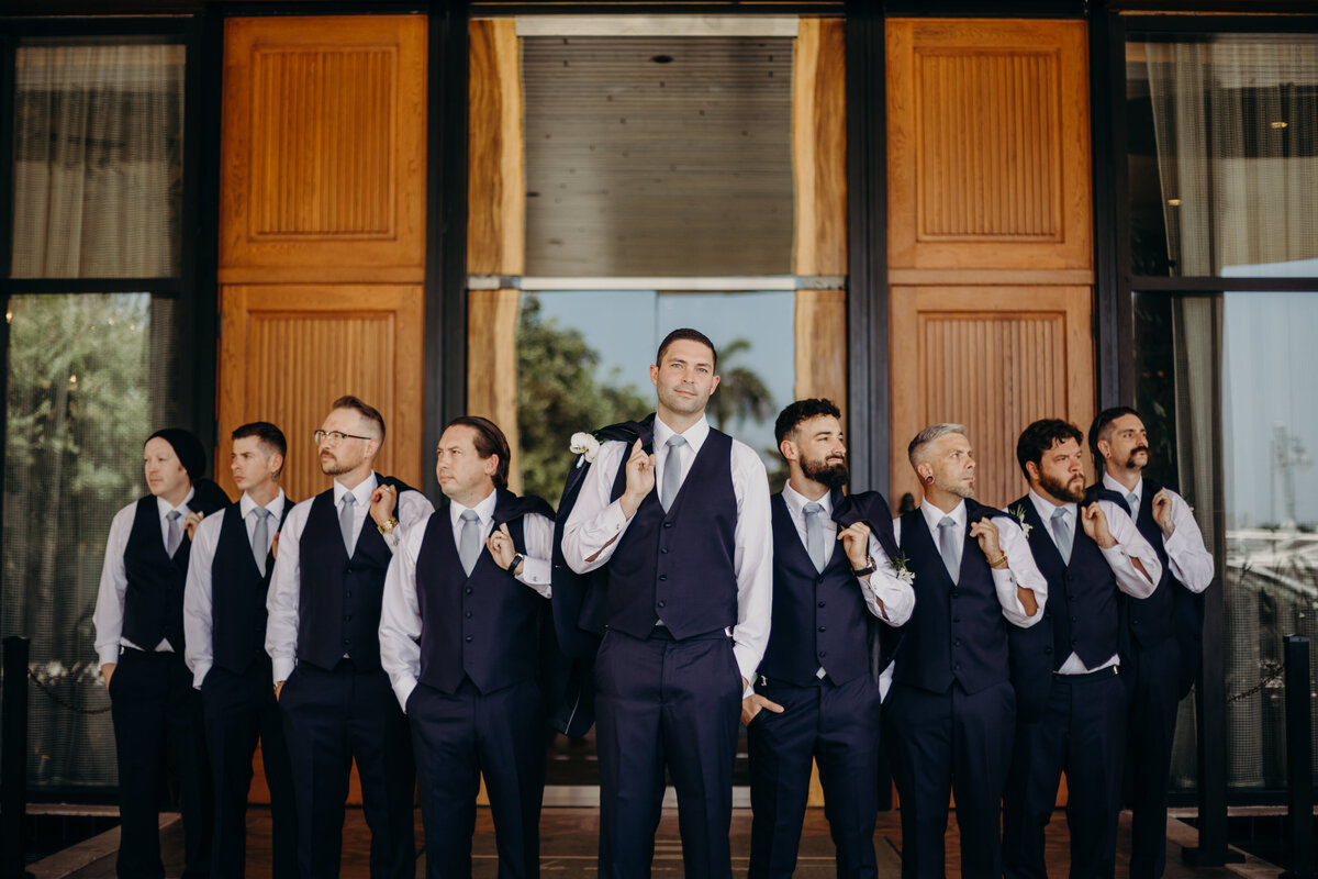 groomsmen pose with jackets on should at the ben west palm beach
