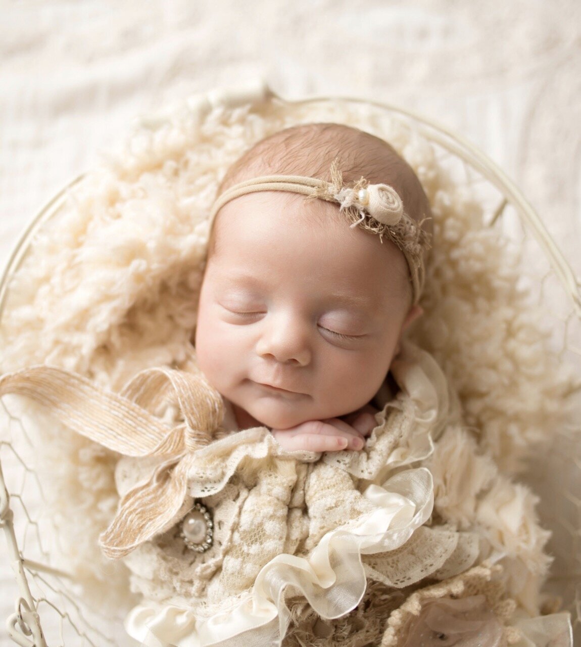 New born baby on white blanket