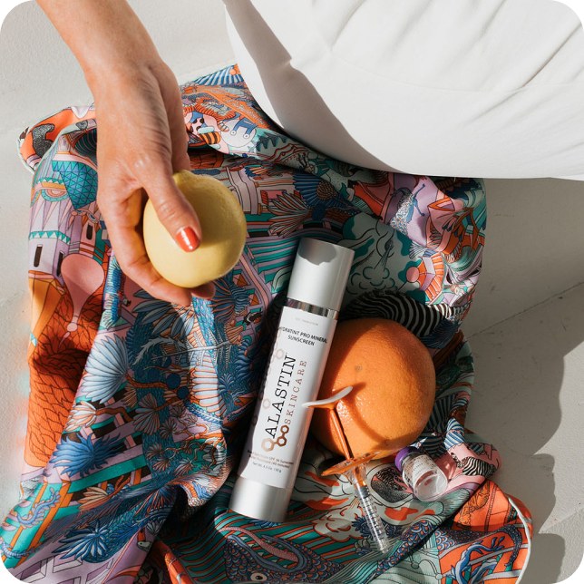 Woman reaching into a makeup bag during a photoshoot directed by Mello Social to help their client elevate their brand imagery. 
