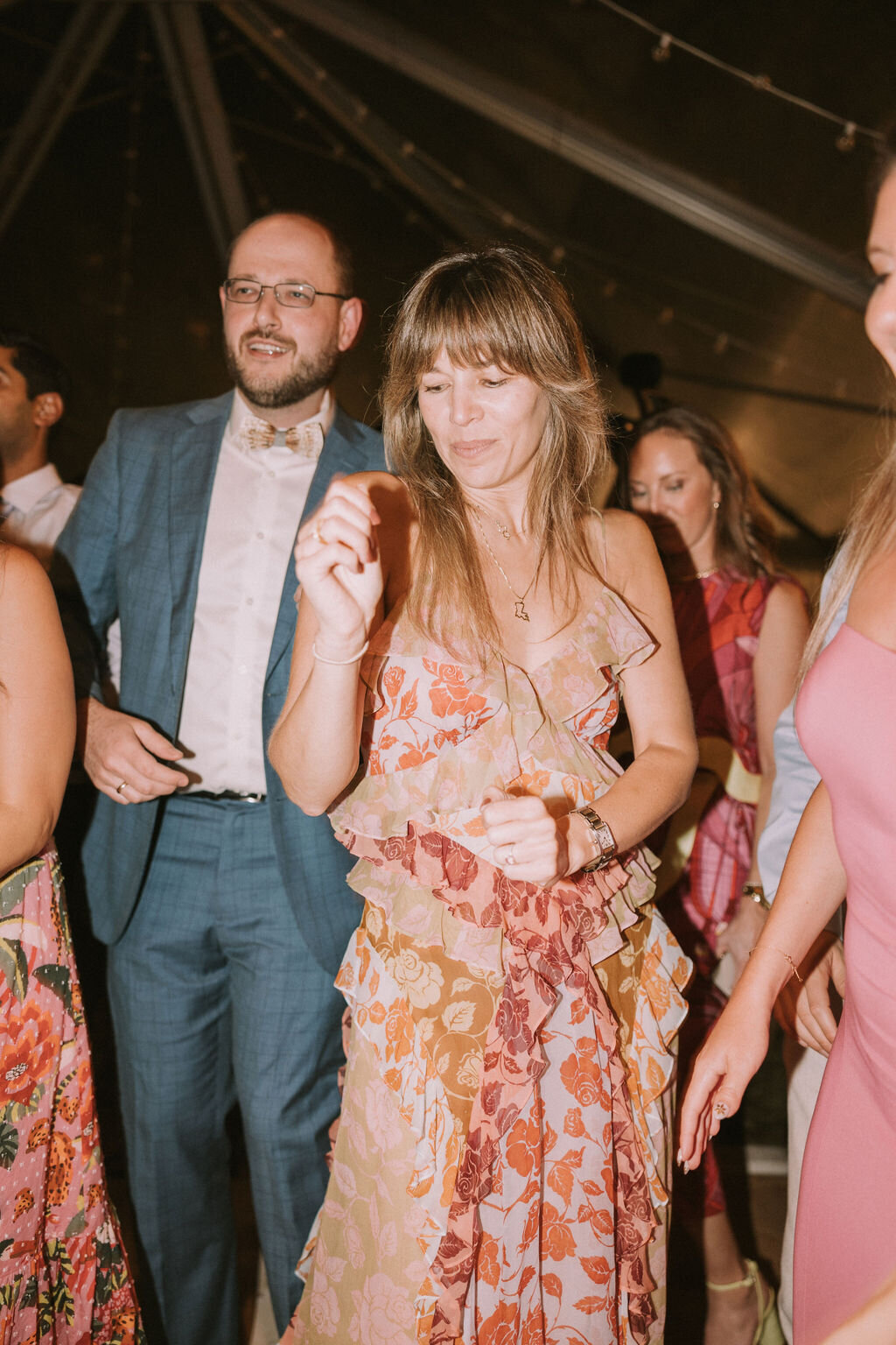 filmy photo of wedding guests at lanikuhonua reception dancing