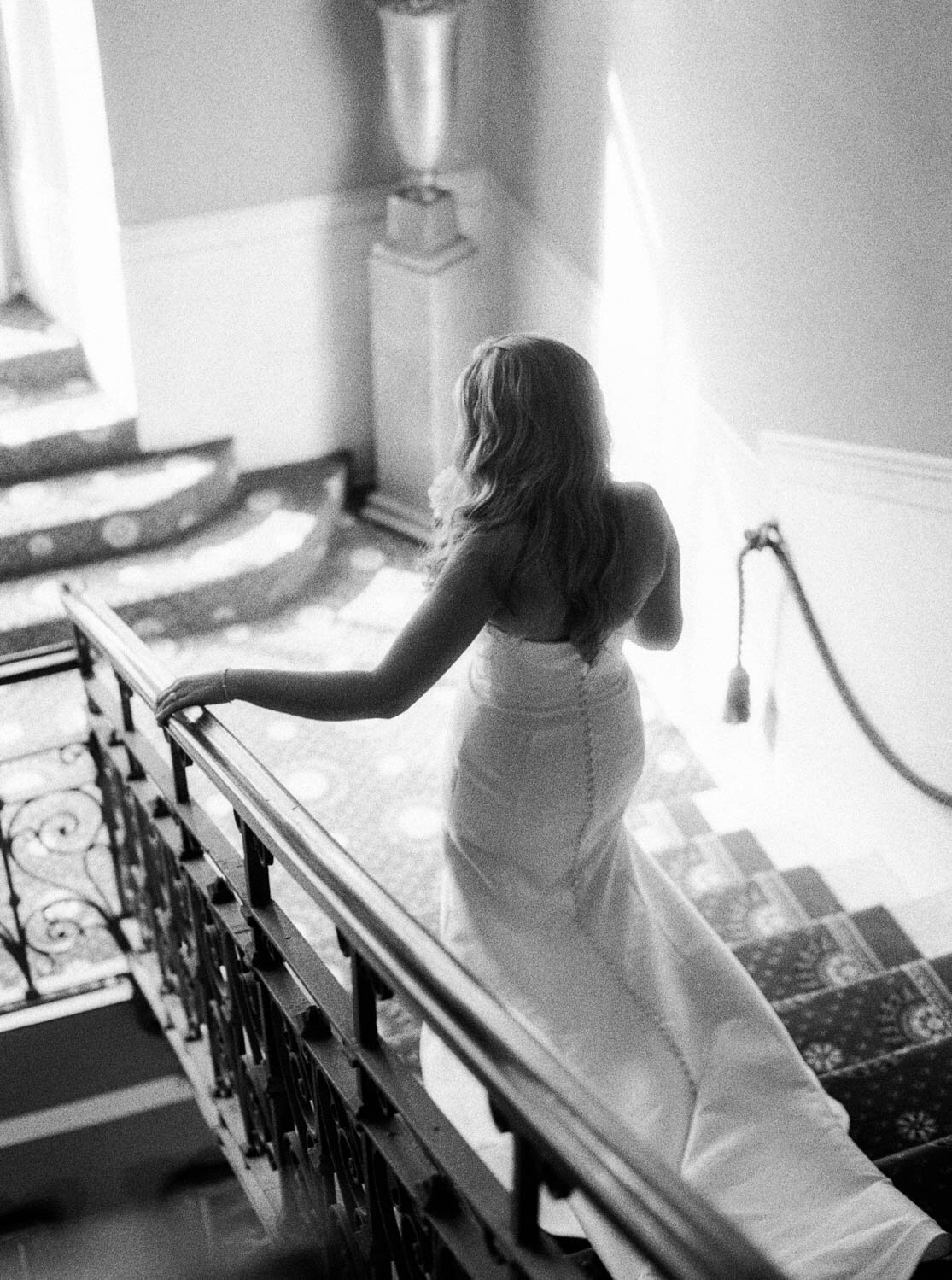 Bride walking to the aisle on black and white Ilford film