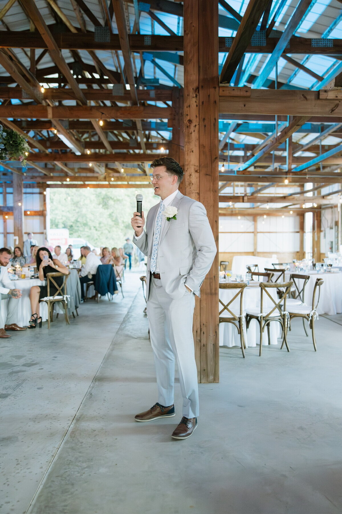 Groom gives a thank you speech to guests at Willstone Acres barn reception hall