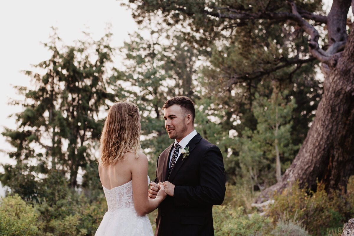 Jackson Hole Photographers capture groom holding bride's hand