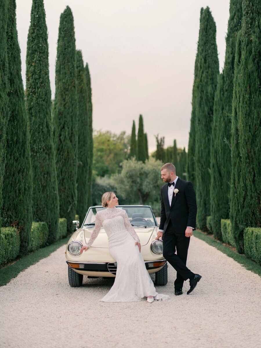 Couple portraits in front of antic car at  Borgo Santo Pietro 