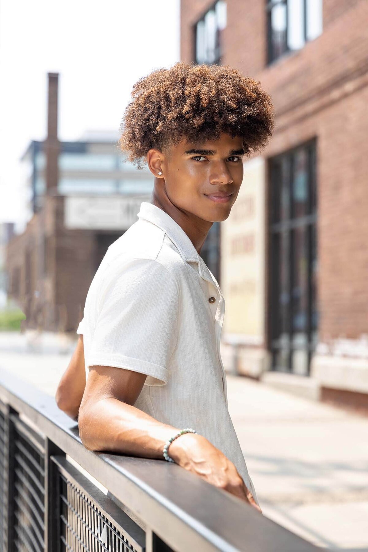 senior-guy-looking-over-shoulder-in-city