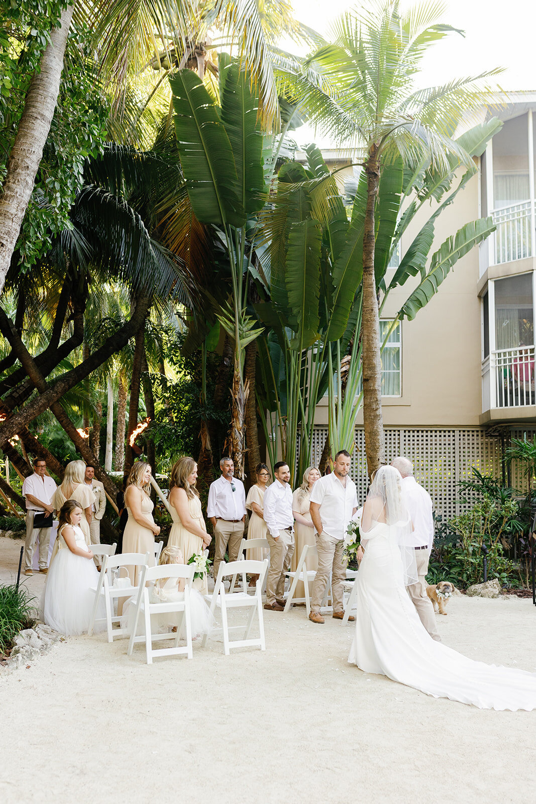  Monica makes her way down the aisle at their intimate Islamorada wedding ceremony, surrounded by friends and family.