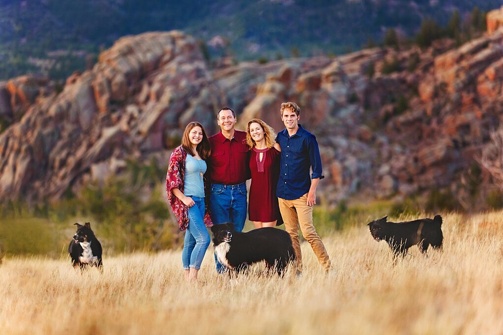 Portrait of a family in the Vedauwoo mountains with their dog.