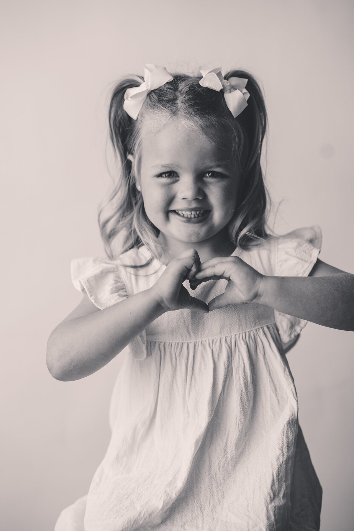 Little girl smiles at the camera during Personality Portrait Photoshoot in Charleston, SC. 