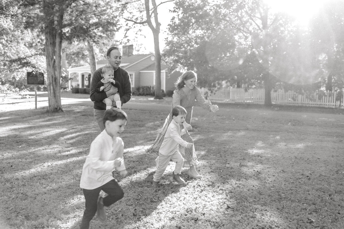 family of five running in black and white