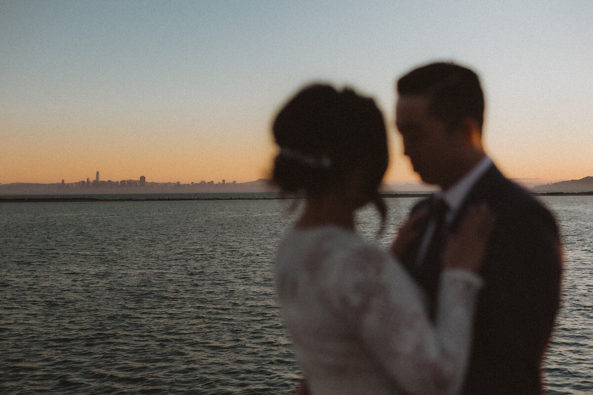 couple embracing by ocean