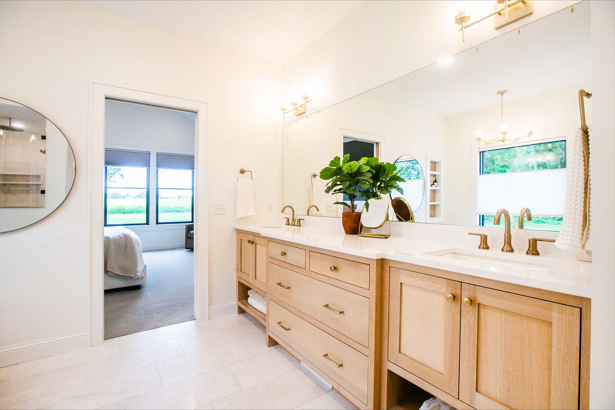 Custom bathroom with soaking tub, double vanity, and walk-in shower in Otsego custom home