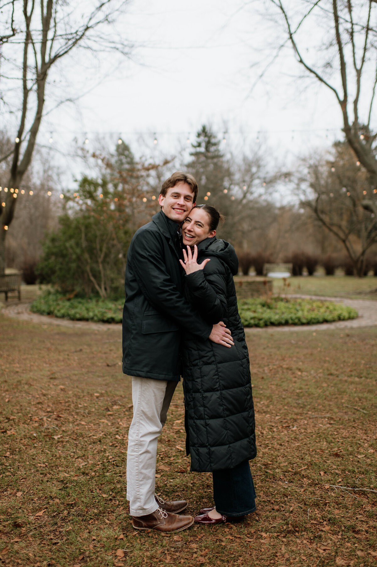 Couple hugging at outdoor engagement photo session