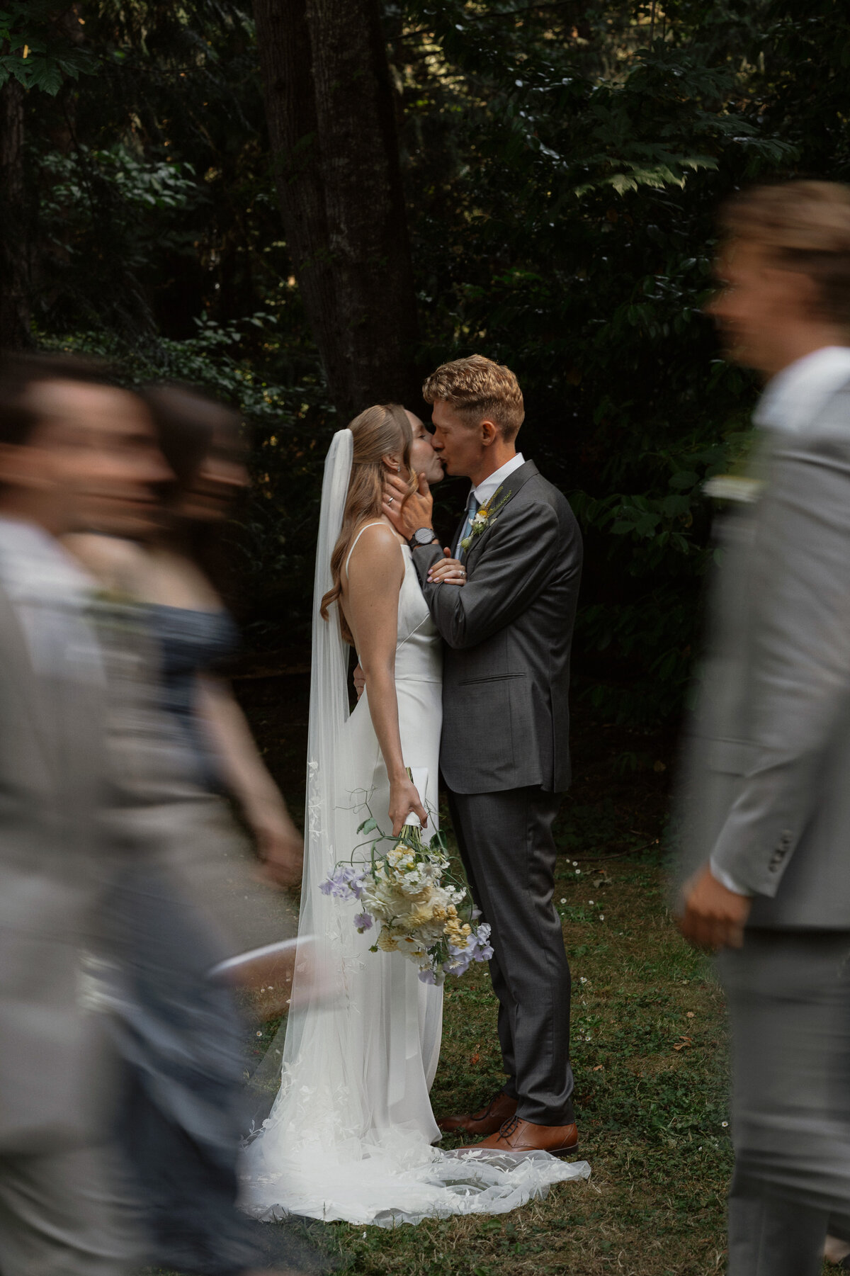 Bride and groom motion photo with their wedding party at Heritage Acres in Saanichton by Latitude 49 Photography