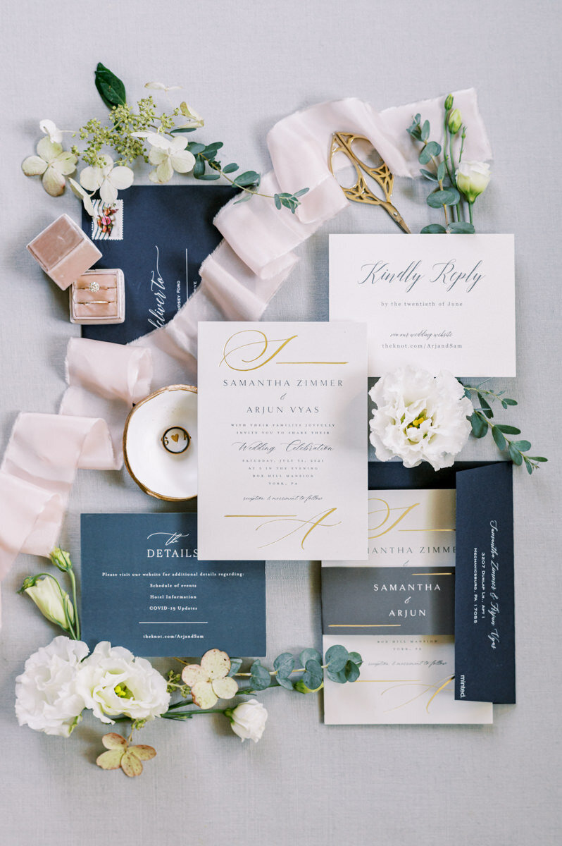 A navy and gold invitation suite at Box Hill Mansion