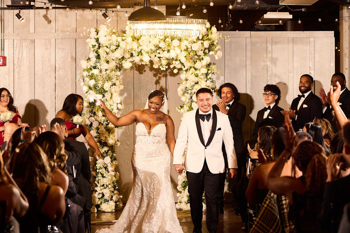 Bride and groom walking down the aisle 