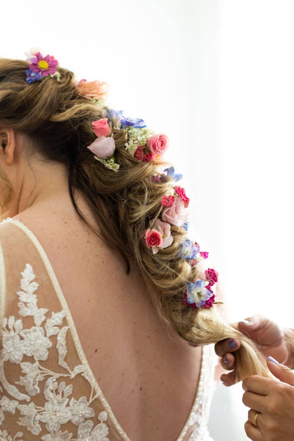 bridal-hair-with-fresh-flowers-in-braid