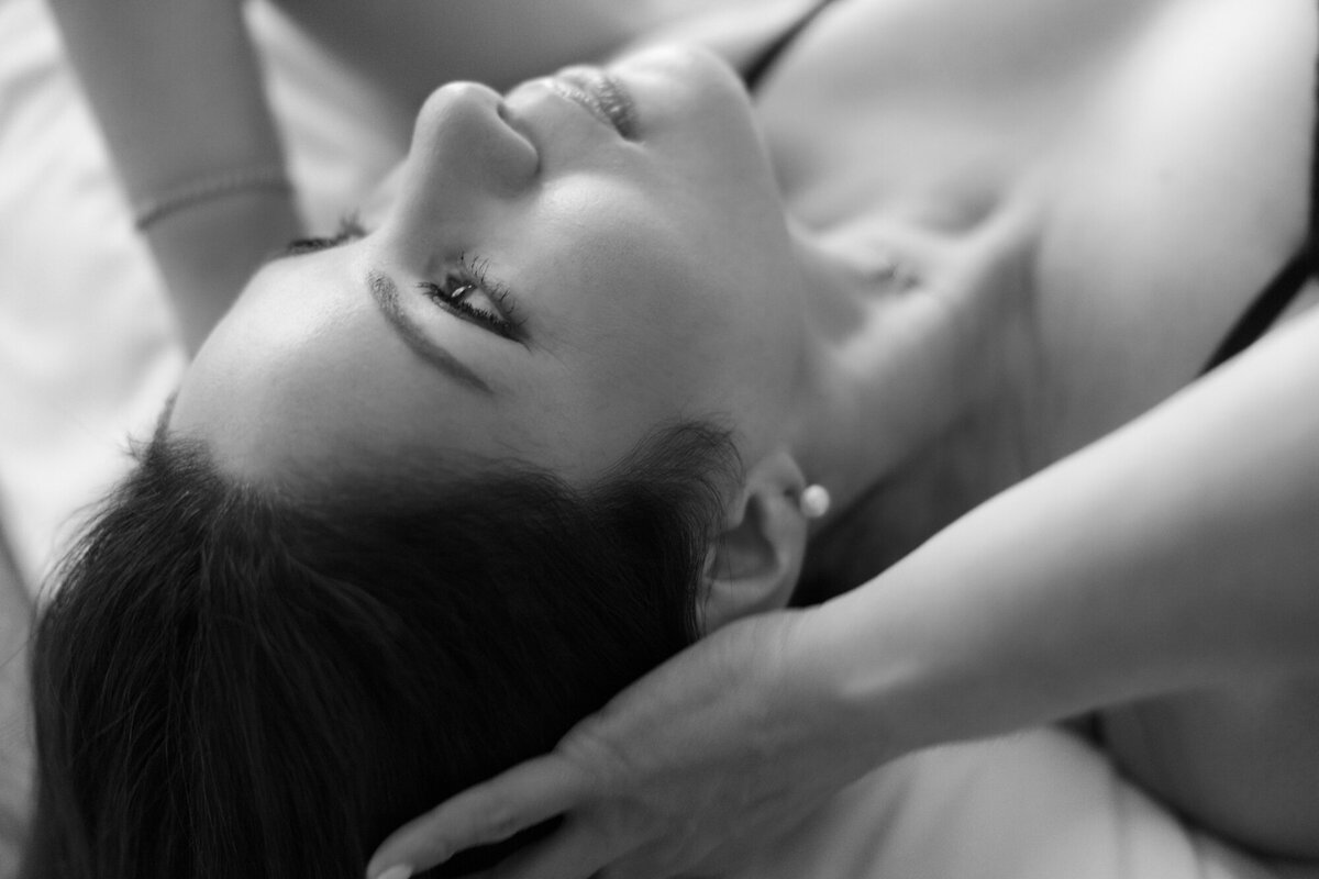 Fine art boudoir photo of woman in Chicago hotel room with soft natural light