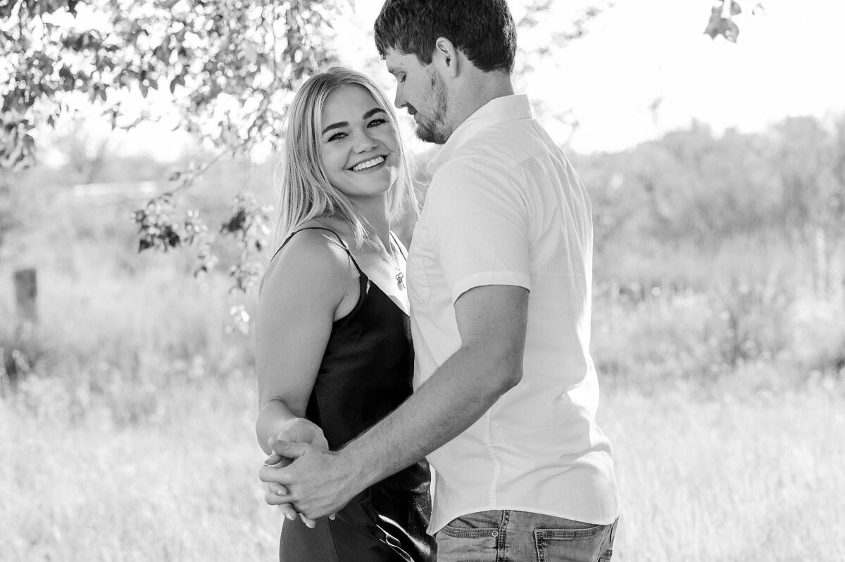 Lubbock family photographer, Mary Wiebe captured a couple holding hands smiling at the camera.