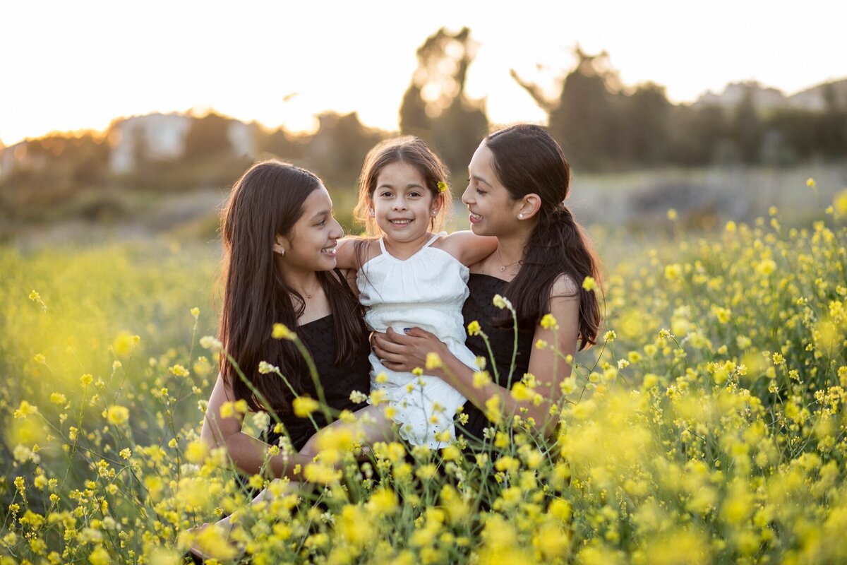 Three girls in flower field | Maternity Session