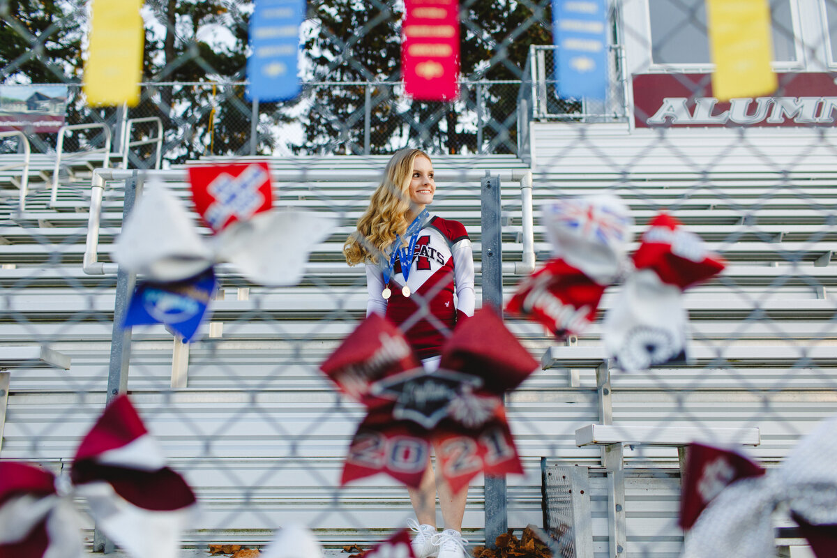 Mechanicsburg-PA-Senior-pictures-cheerleader-bleachers-football-field-unique-sports-portraits