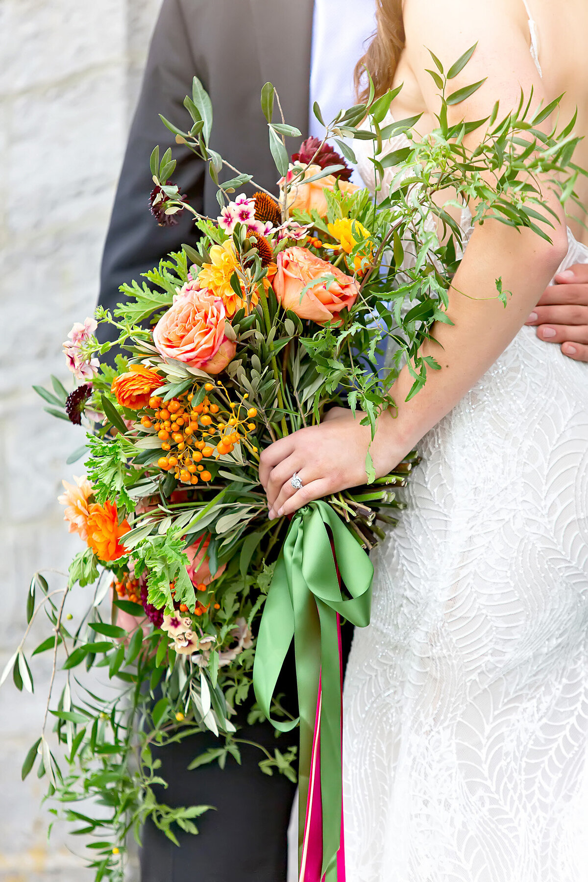 Bride holding classic white bouquet at Tuscan luxury wedding with plum, gold, and baby blue décor