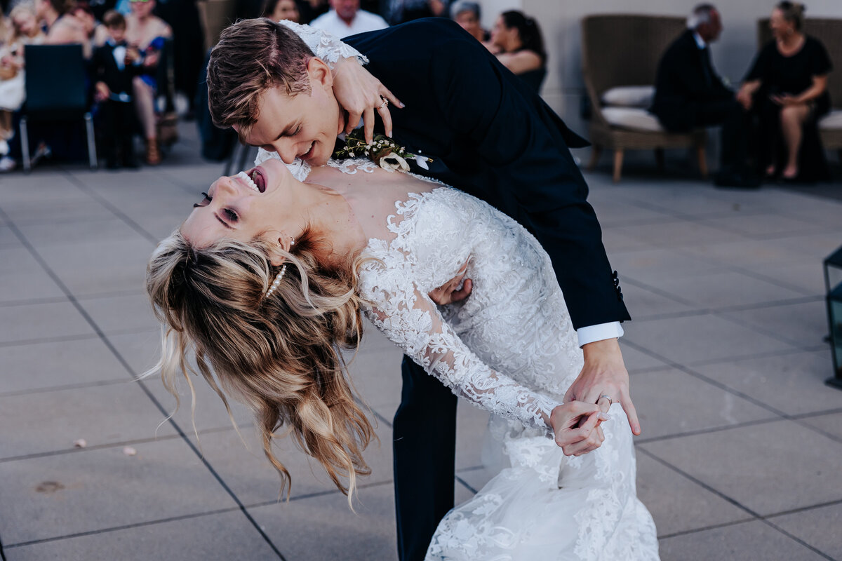 Nashville wedding photographer captures bride and groom dancing and kissing bride's neck