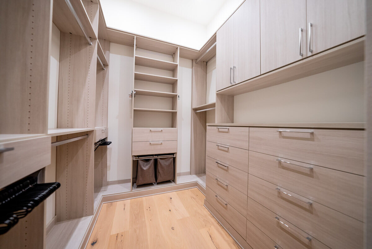 Custom closet design with drawers and cabinets