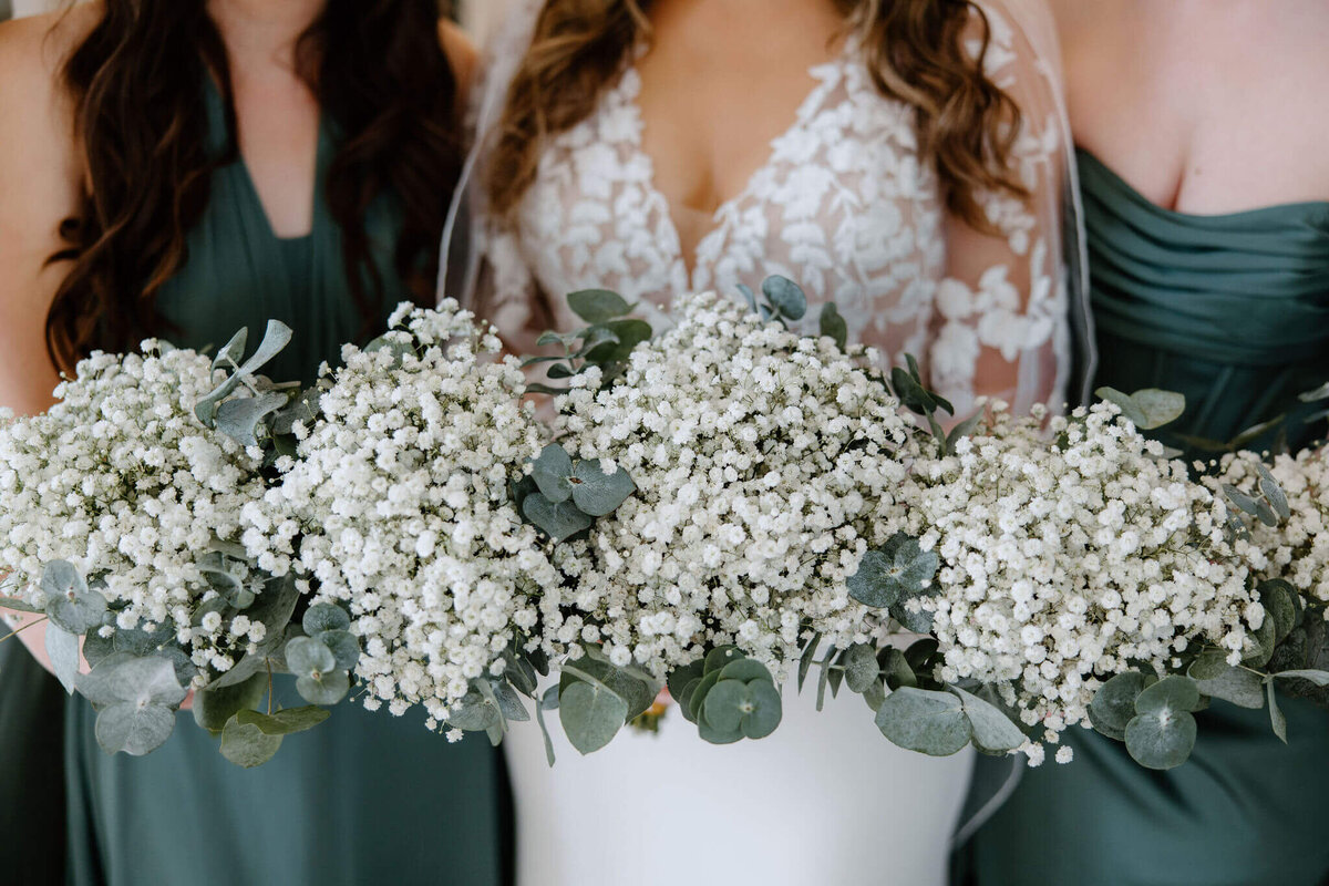 bridal party bouquets of fresh baby's breath and eucalyptus