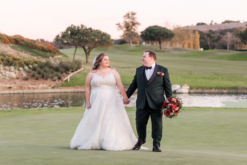 bride-and-groom-walking-on-golf-course-the-crossings-carlsbad-wedding