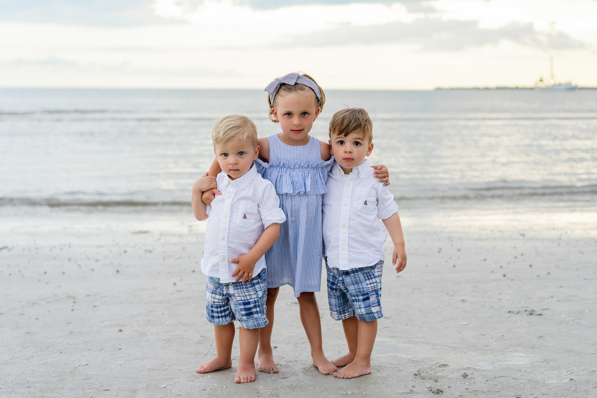 three small children standing together on Fort Myers Beach Florida