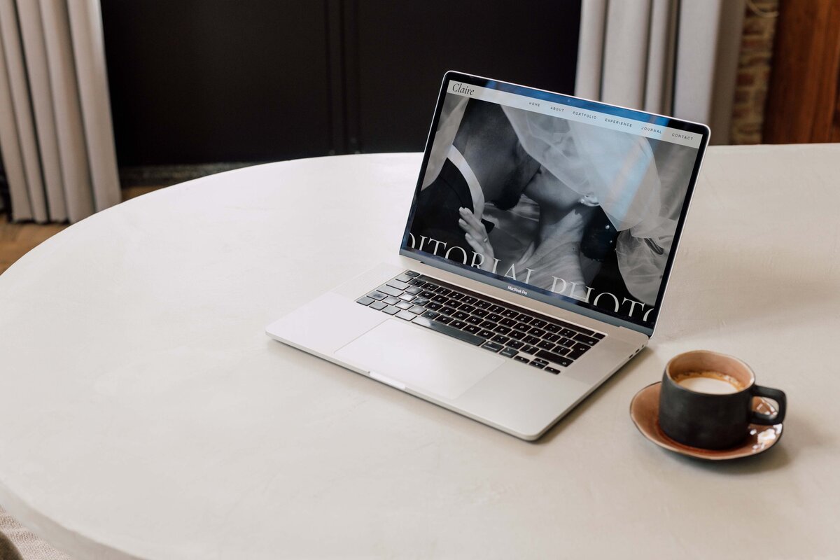 Laptop displaying Claire Showit website homepage with Timeless, Editorial Branding