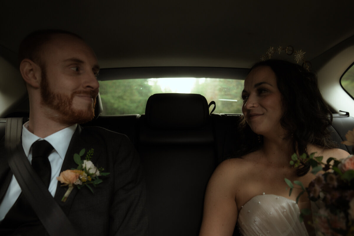 Bride and groom in car on their wedding day cinematic photography in oregon