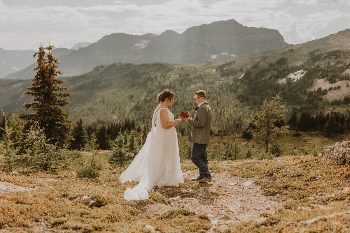 Beautiful couple sharing vow in the mountains in Banff, AB