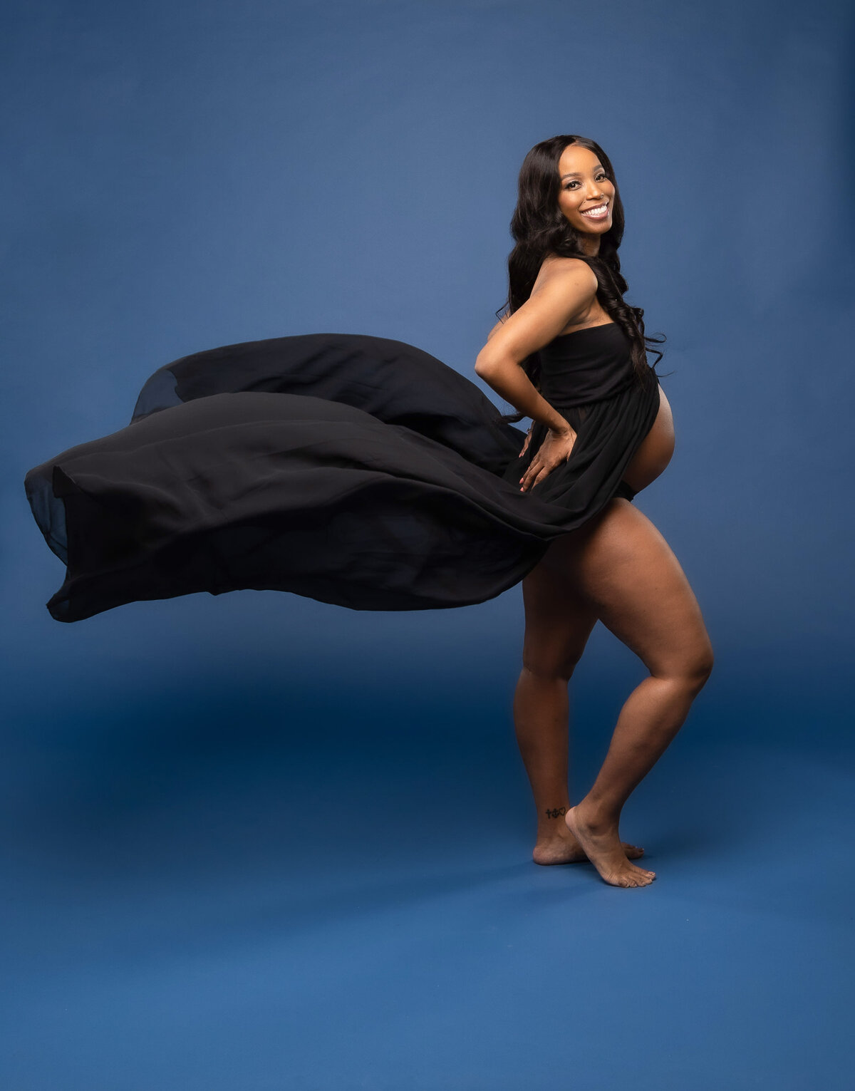 Black pregnant mom to be in black dress