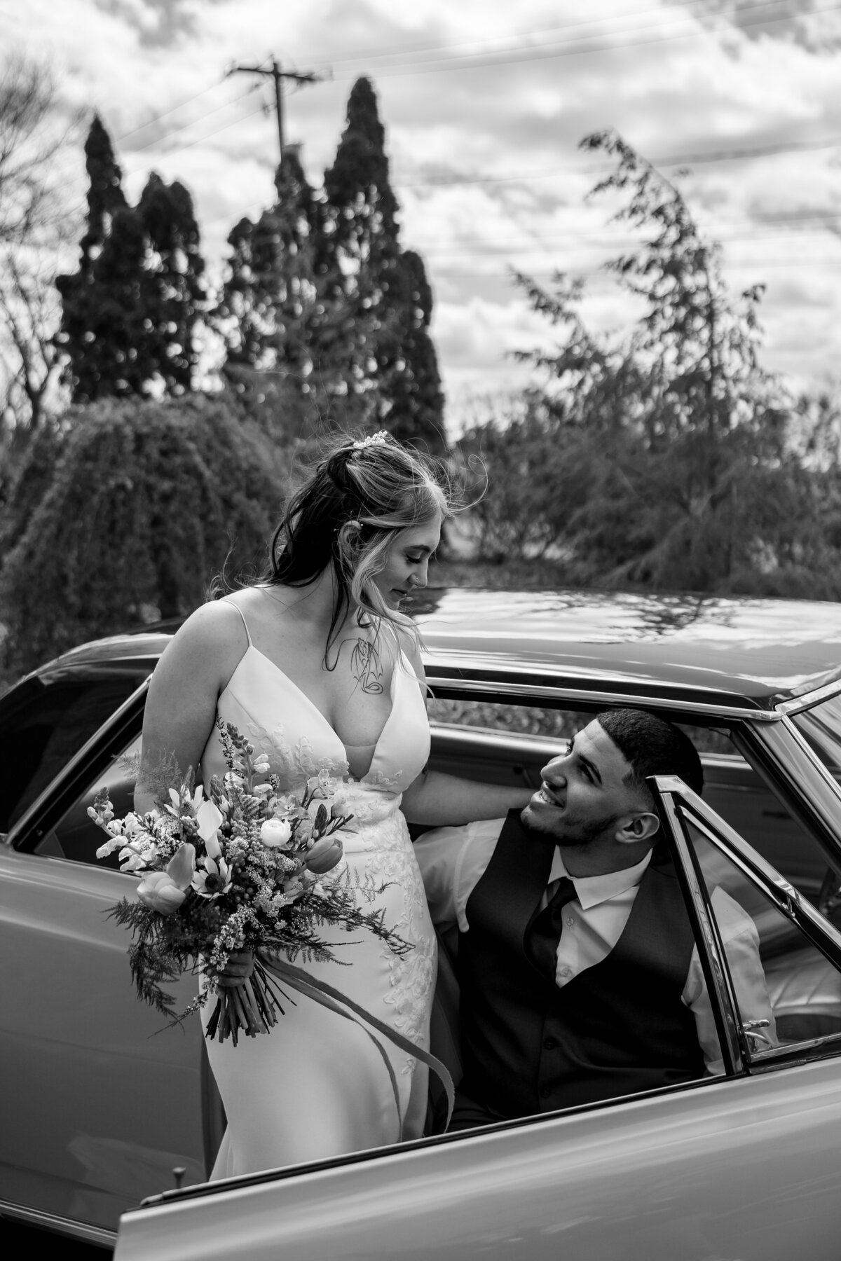 couple getting into old car at bear mill estate wedding photography by good omen photo co