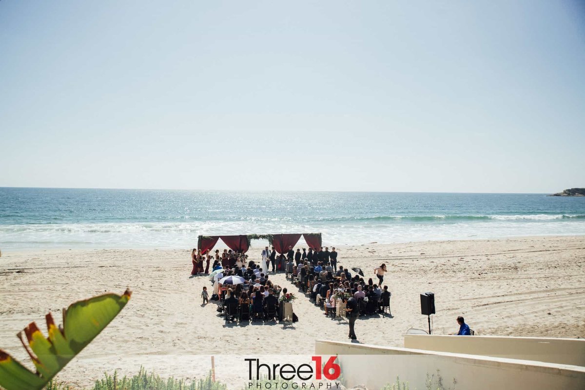Wedding ceremony taking place on the sands of Salt Creek Beach