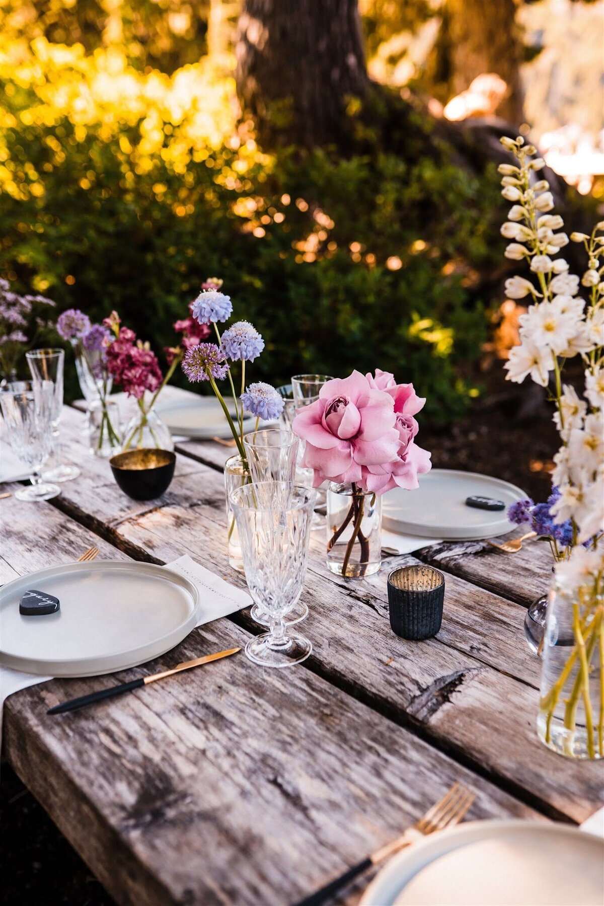 Elopement picnic near Mount Baker with edgy black touches and purple & pink meadow-inspired flowers!