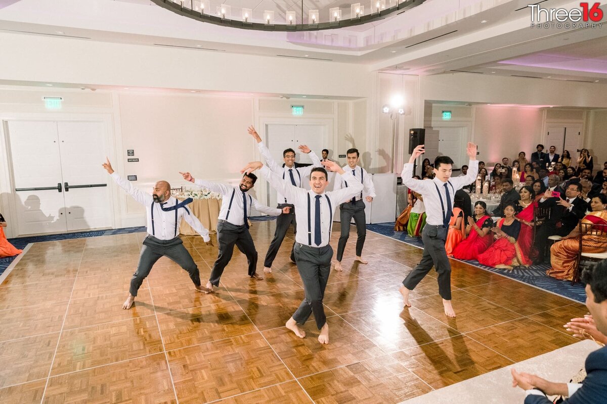 Men get out of the dance floor and perform a traditional Indian dance