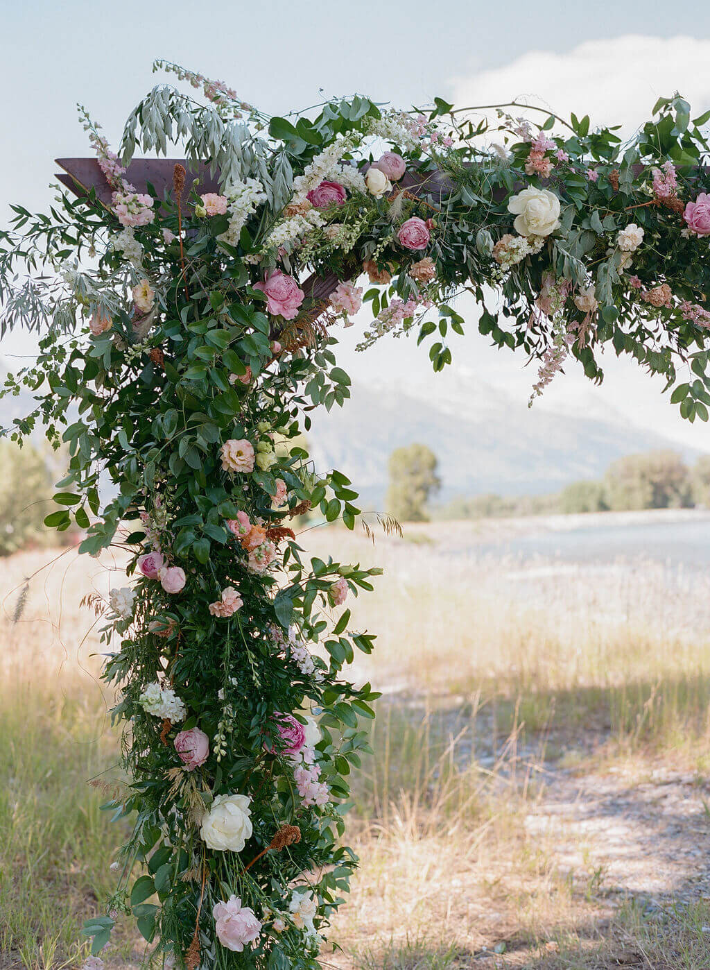 peony pink and white arbor jackson hole wedding florist
