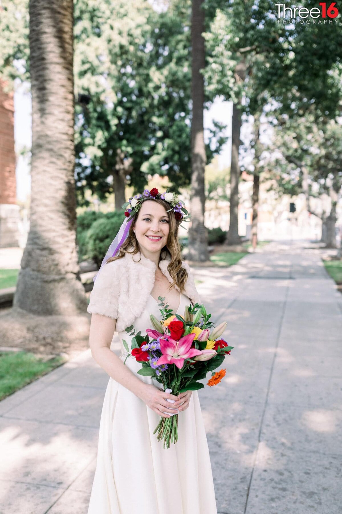 Beautiful Bride to be poses with her bouquet of flowers before her elopement